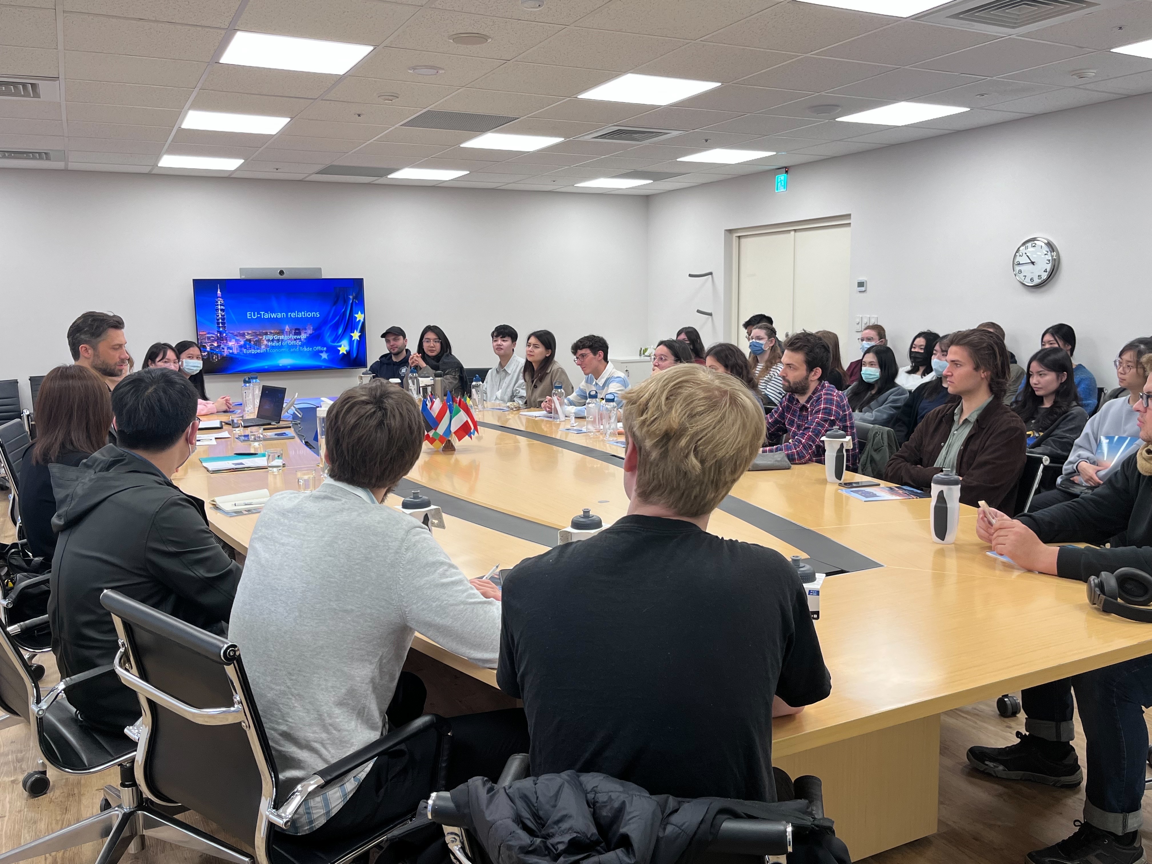 Mr. Filip Grzegorzewski answering a wide range of questions from the diverse group of students from Taiwan, France, Austria, and other countries.